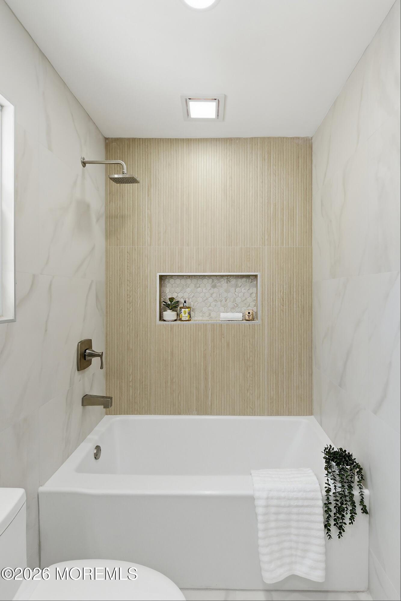 16 6th Street Barnegat, NJ 08005 - Photo 32 of 36 a bathroom with a bathtub and a shower