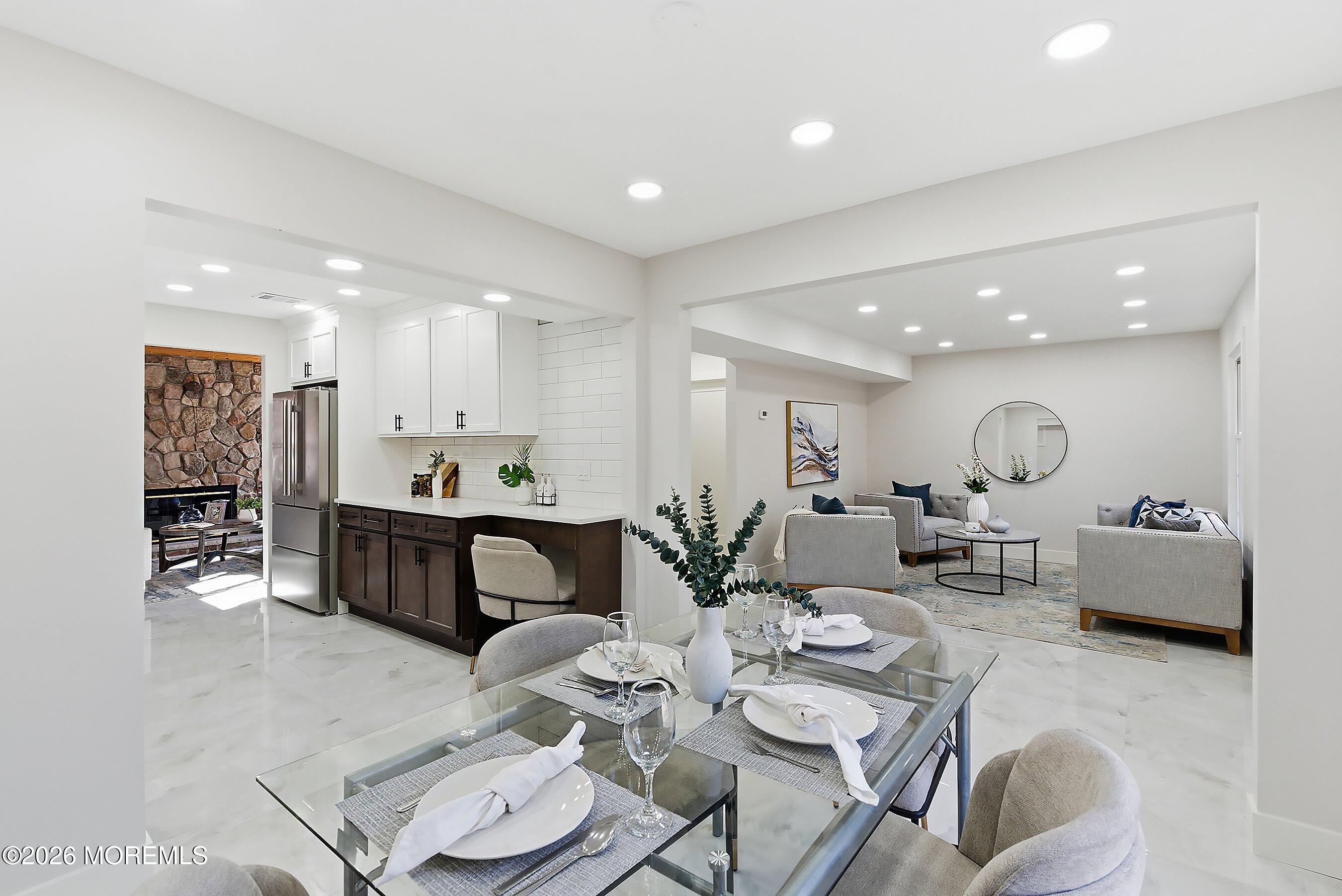 16 6th Street Barnegat, NJ 08005 - Photo 8 of 36 a very nice looking dining room with kitchen island furniture a chandelier and a view of kitchen