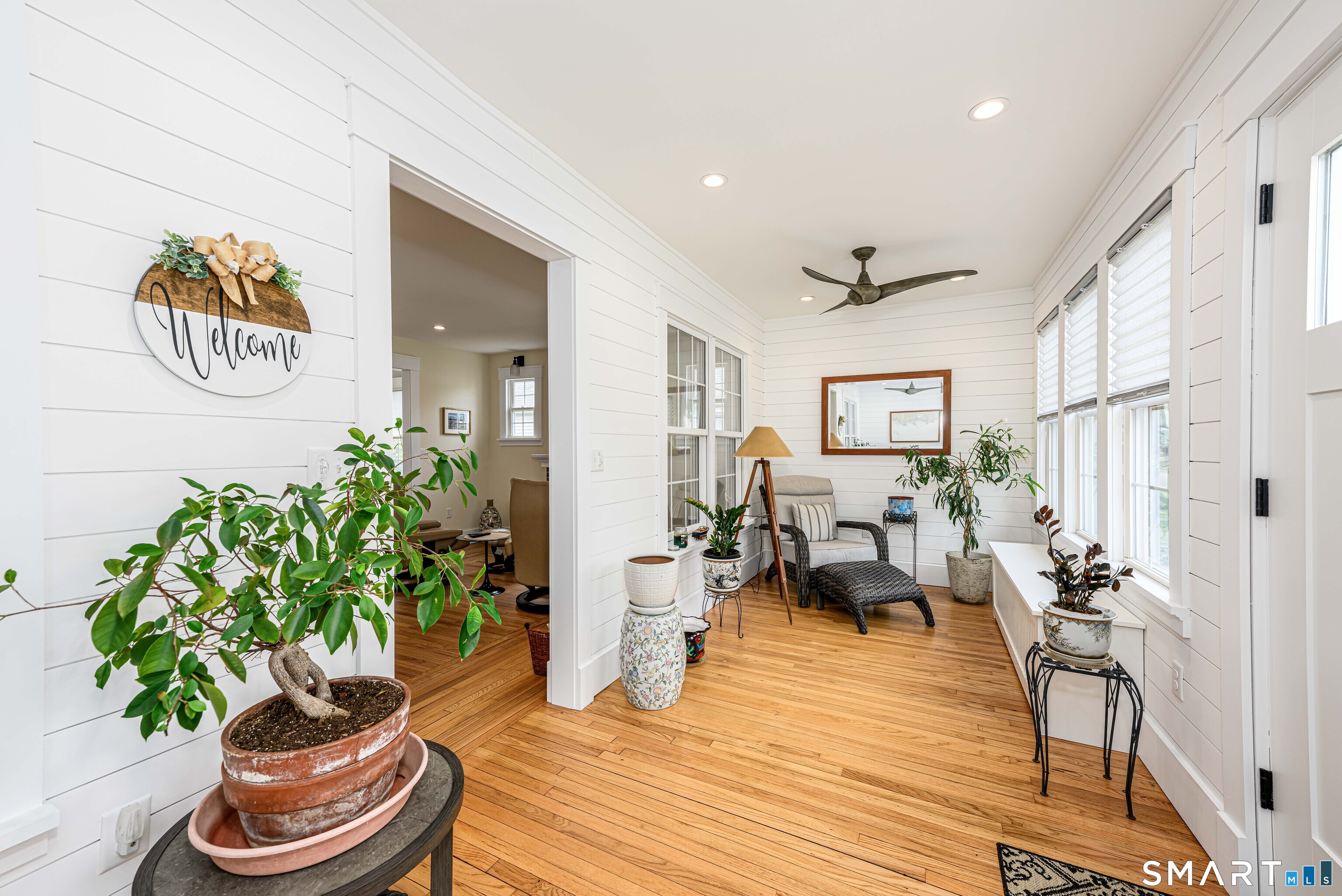 77 Prospect Road East Haven, CT 06512 - Photo 9 of 31 Enclosed heated sun room/porch and shiplap walls. Great place to unwind and relax after a busy day.