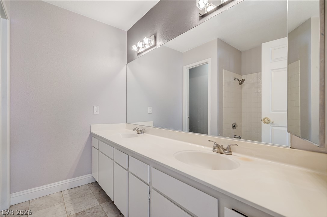 6635 Costa Brava Road Las Vegas, NV 89146 - Photo 40 of 59 Double vanity with ample counter space and a full-width mirror defines this functional bathroom.