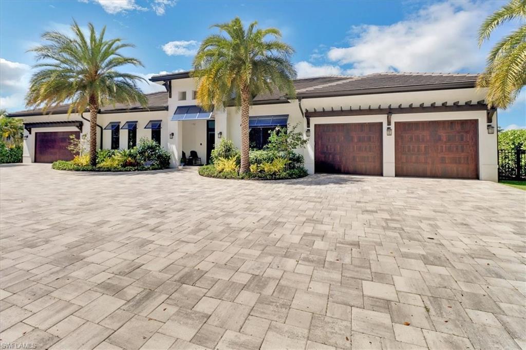 1425 Crayton Road Naples, FL 34102 - Photo 1 of 31 Mediterranean / spanish-style house with a garage