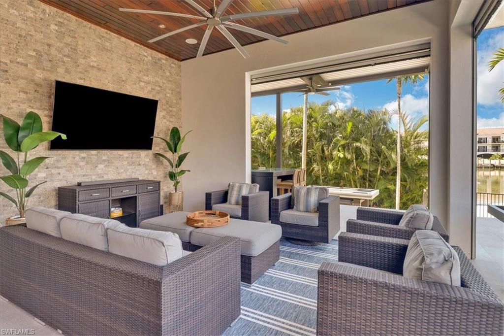 1425 Crayton Road Naples, FL 34102 - Photo 25 of 31 View of patio with an outdoor living space and ceiling fan