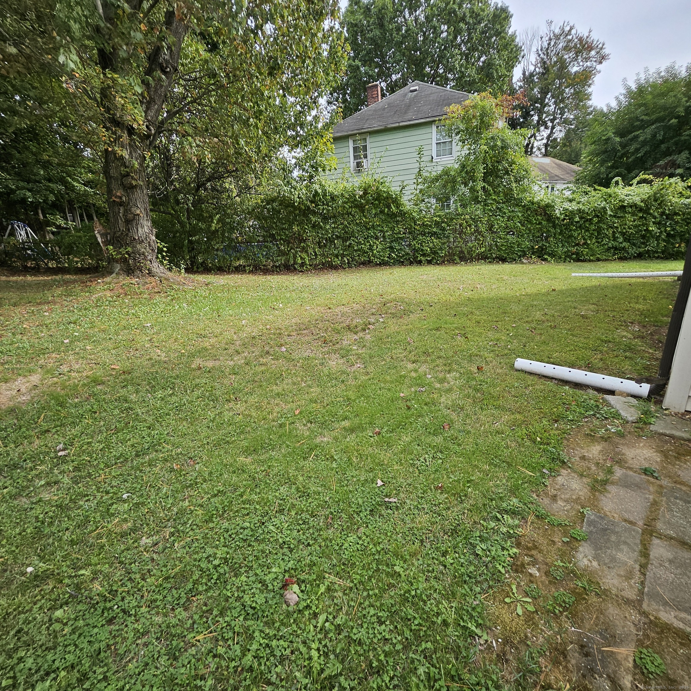 430 Pearl Harbor Street Bridgeport, CT 06610 - Photo 12 of 12 a view of a house with a yard