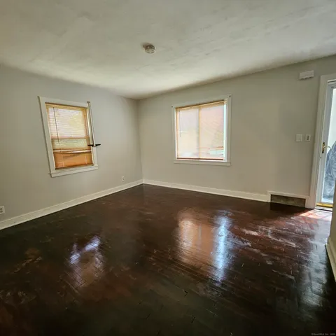 a view of room window and wooden floor