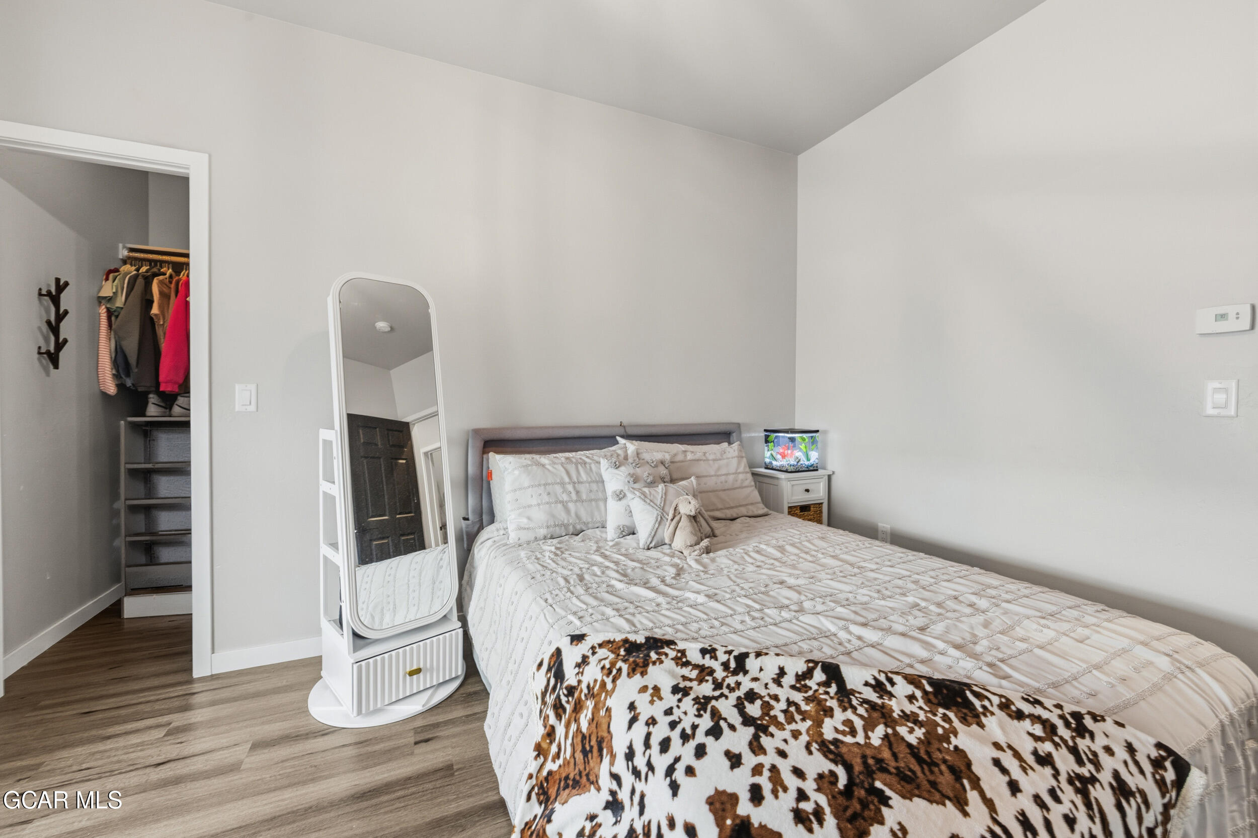 503 12th Street, Unit B Kremmling, CO 80459 - Photo 21 of 44 a bedroom with a bed and a wooden floor