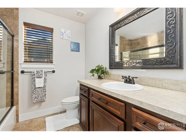 a balcony with furniture and wooden floor