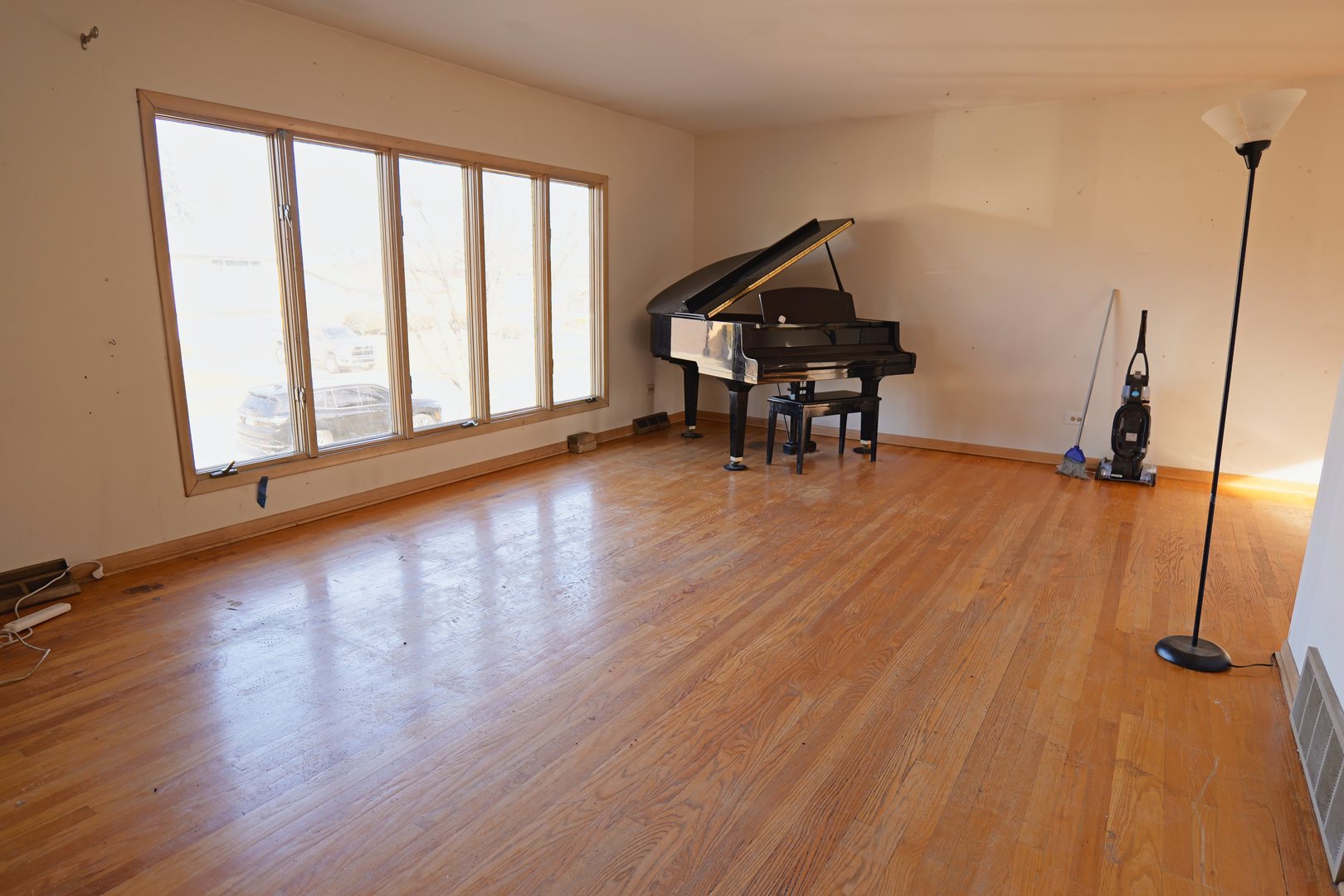 6432 Cedar Road Oak Forest, IL 60452 - Photo 2 of 14 a view of empty room with wooden floor and fan