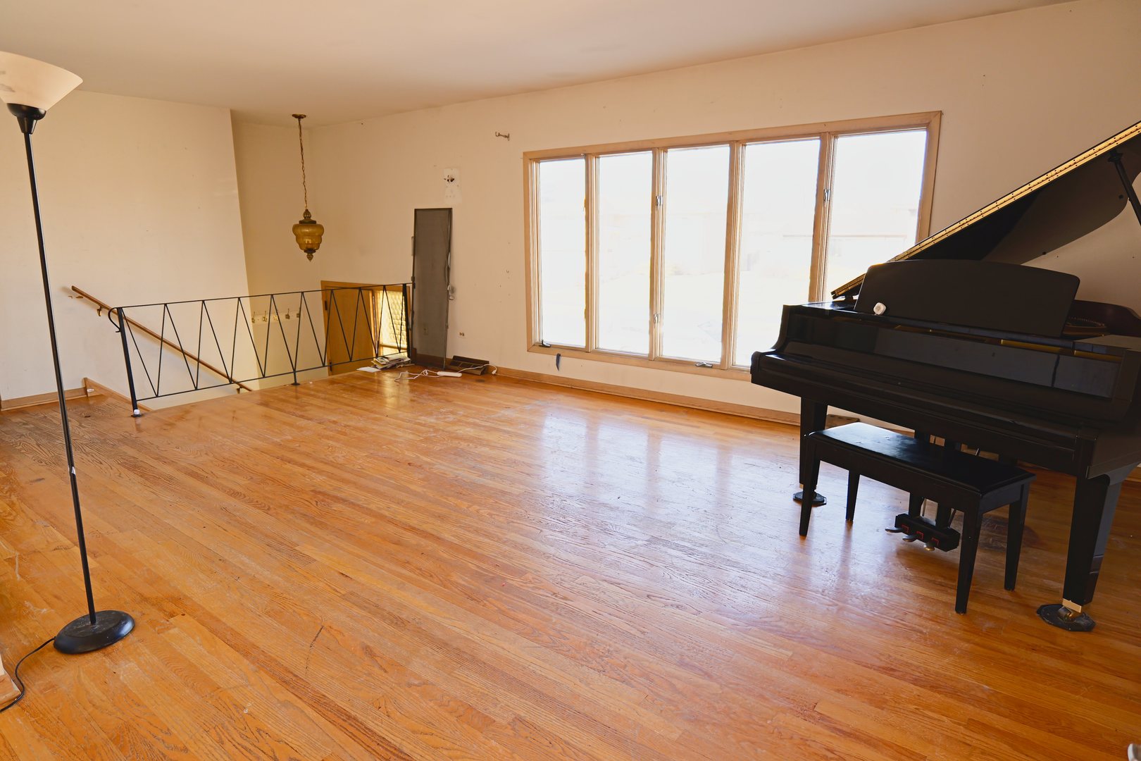6432 Cedar Road Oak Forest, IL 60452 - Photo 3 of 14 a view of an empty room with wooden floor and a window