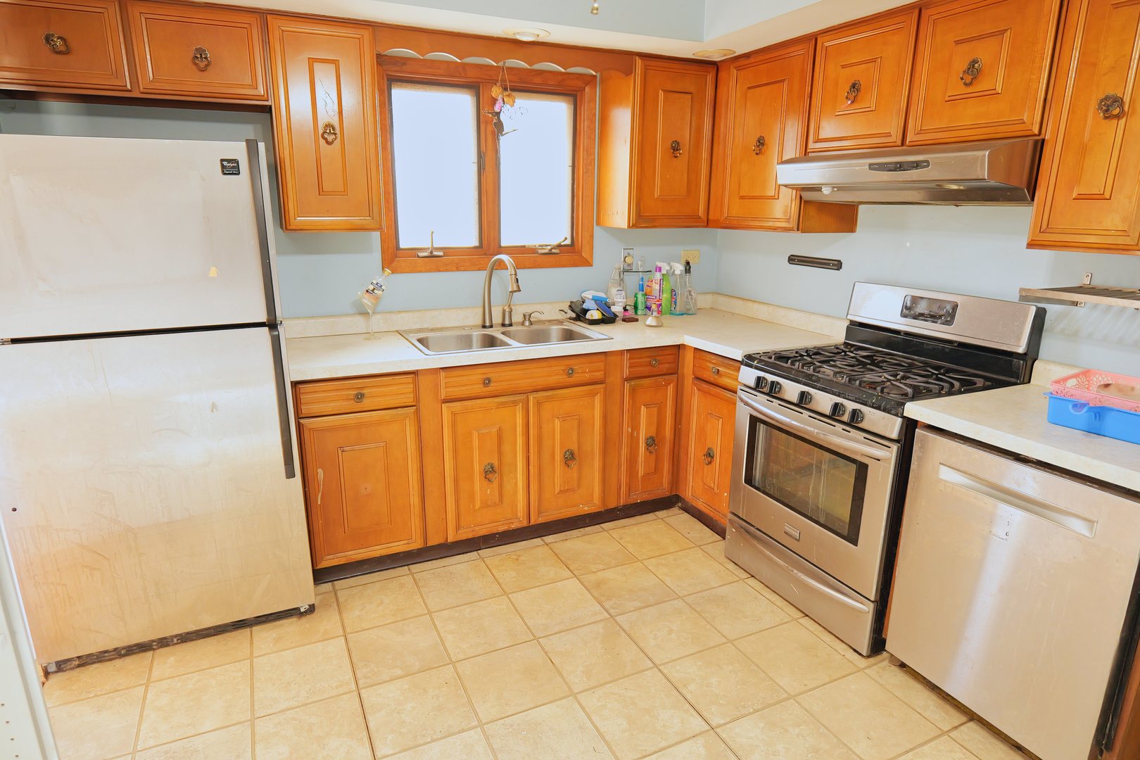 6432 Cedar Road Oak Forest, IL 60452 - Photo 5 of 14 a kitchen with a refrigerator sink stove and cabinets
