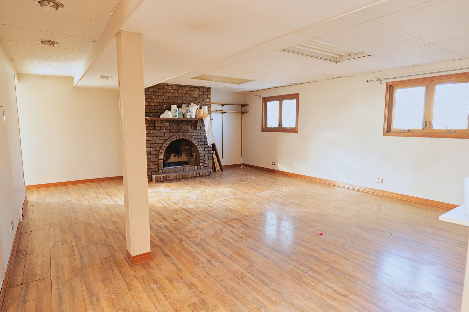 6432 Cedar Road Oak Forest, IL 60452 - Photo 10 of 14 a view of an empty room with wooden floor fireplace and a window