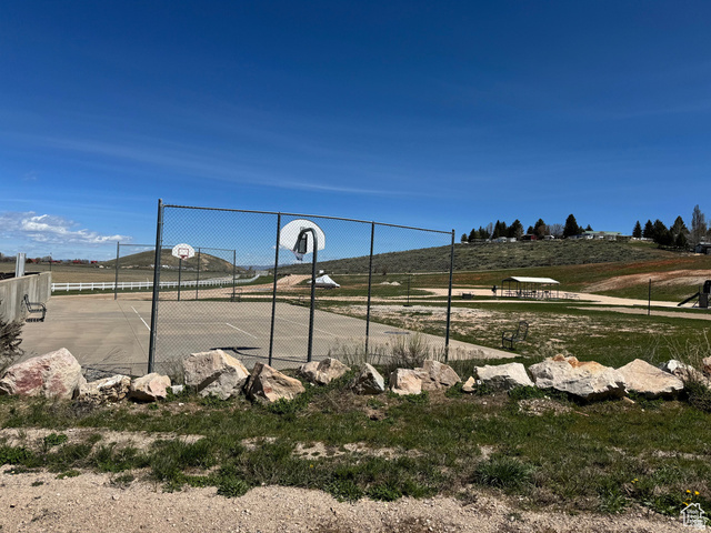 972 Ridgeway Loop, Unit 228 Garden City, UT 84028 - Photo 25 of 26 View of community featuring community basketball court