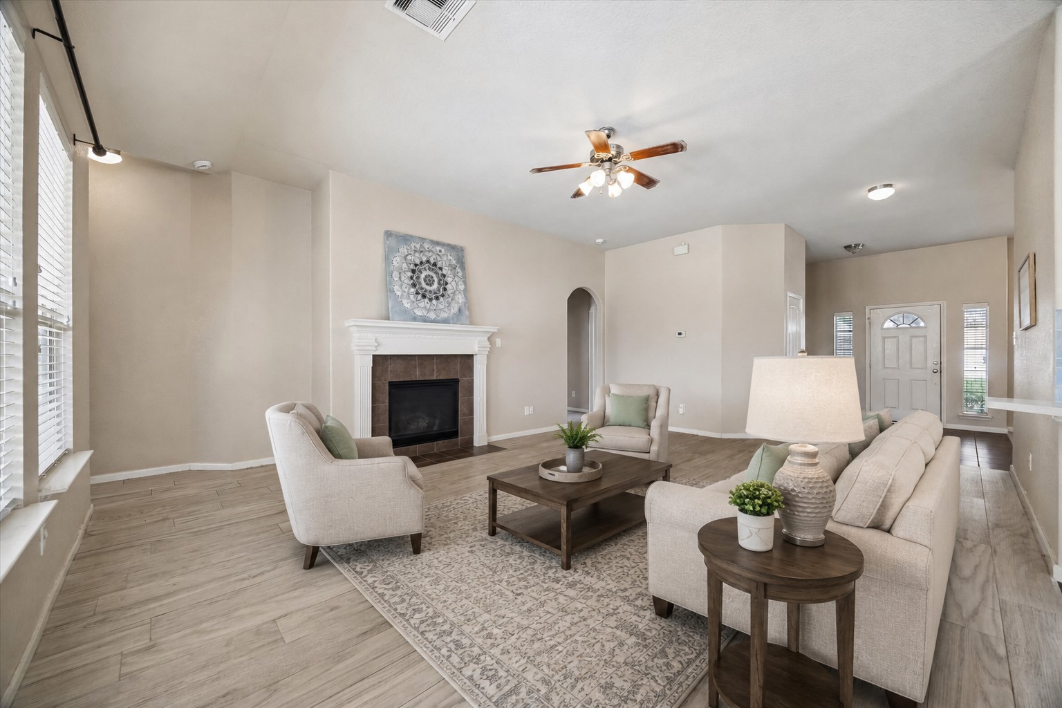 7806 Summer Night Lane Rosenberg, TX 77469 - Photo 4 of 23 This wide-angle view shows the open-concept layout connecting the fireplace-anchored living room to the front entrance. **This room has been virtually staged.
