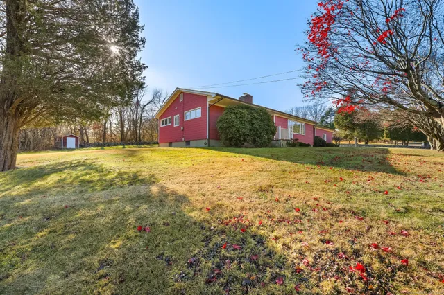 a view of a yard with a house