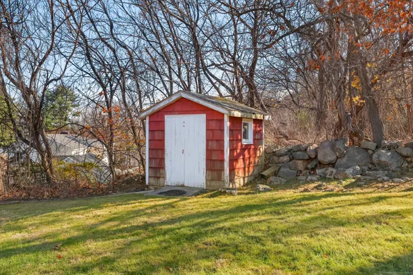 a view of a house with a yard covered with snow