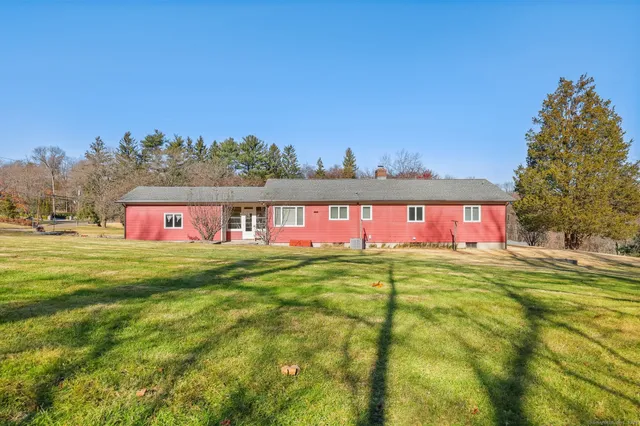a view of a big yard with an outdoor space