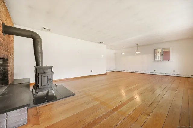 a view of a kitchen with a sink and a mirror
