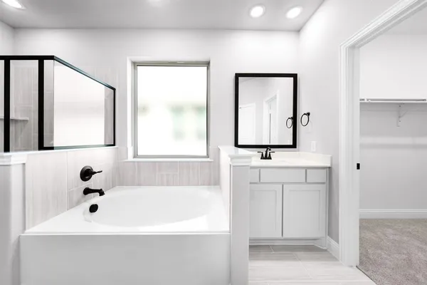 a bathroom with a double vanity sink and mirror