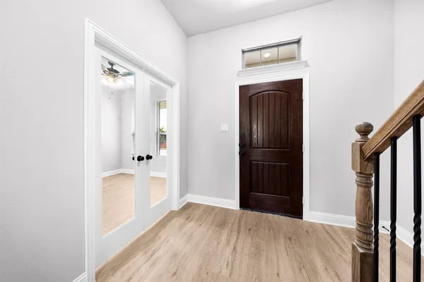 a bathroom with a sink toilet and a mirror