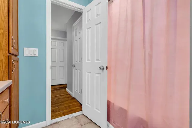 a view of a bathroom with a shower curtain