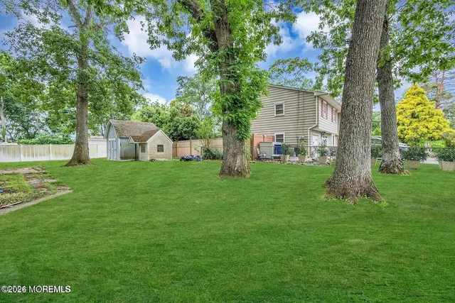 a house view with a sitting space and garden