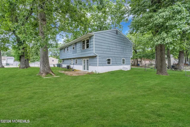 a view of a house with a yard porch and sitting area