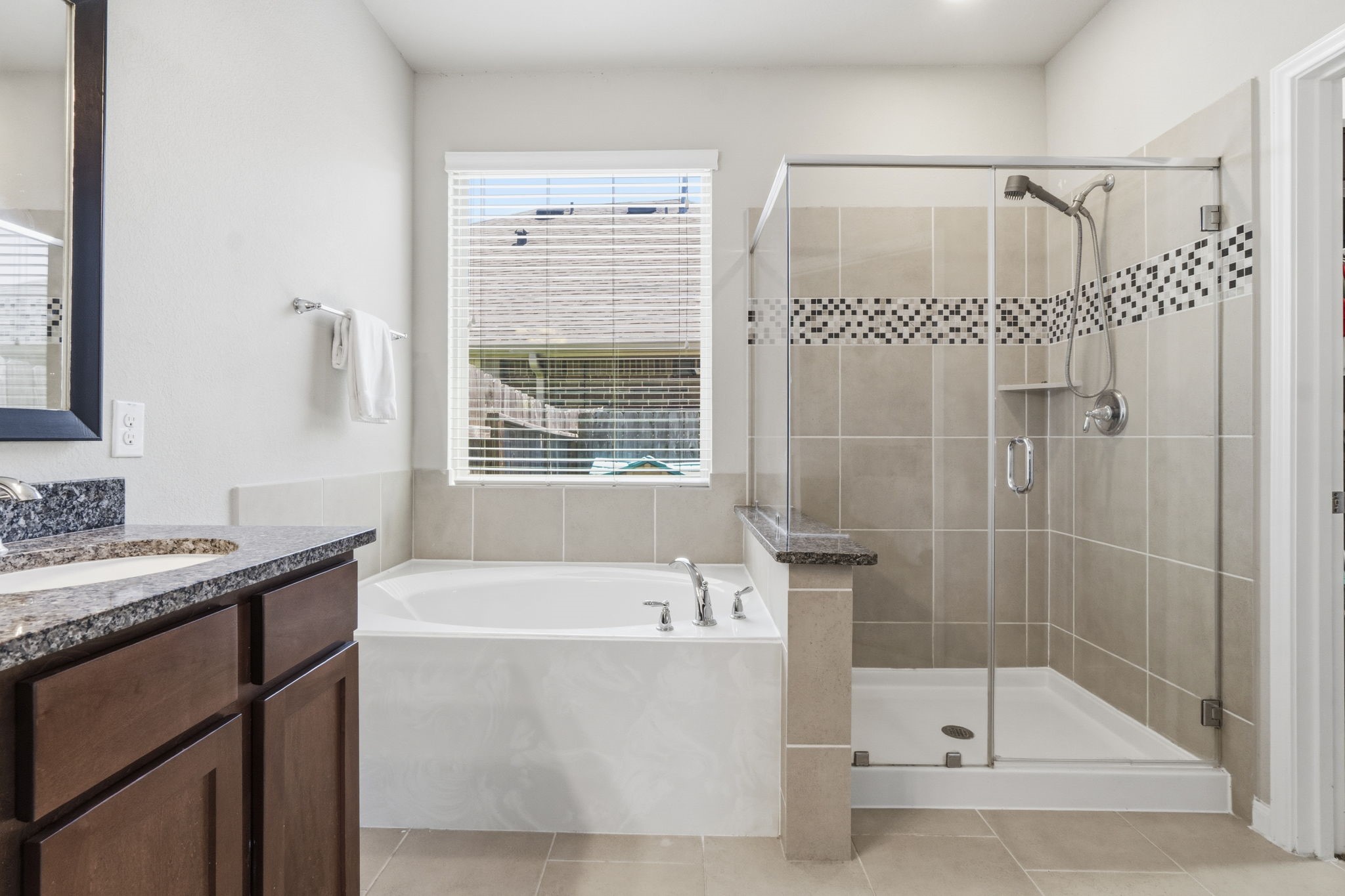 3900 Enchanted Timbers Lane Spring, TX 77386 - Photo 21 of 49 a bathroom with a bathtub and a shower