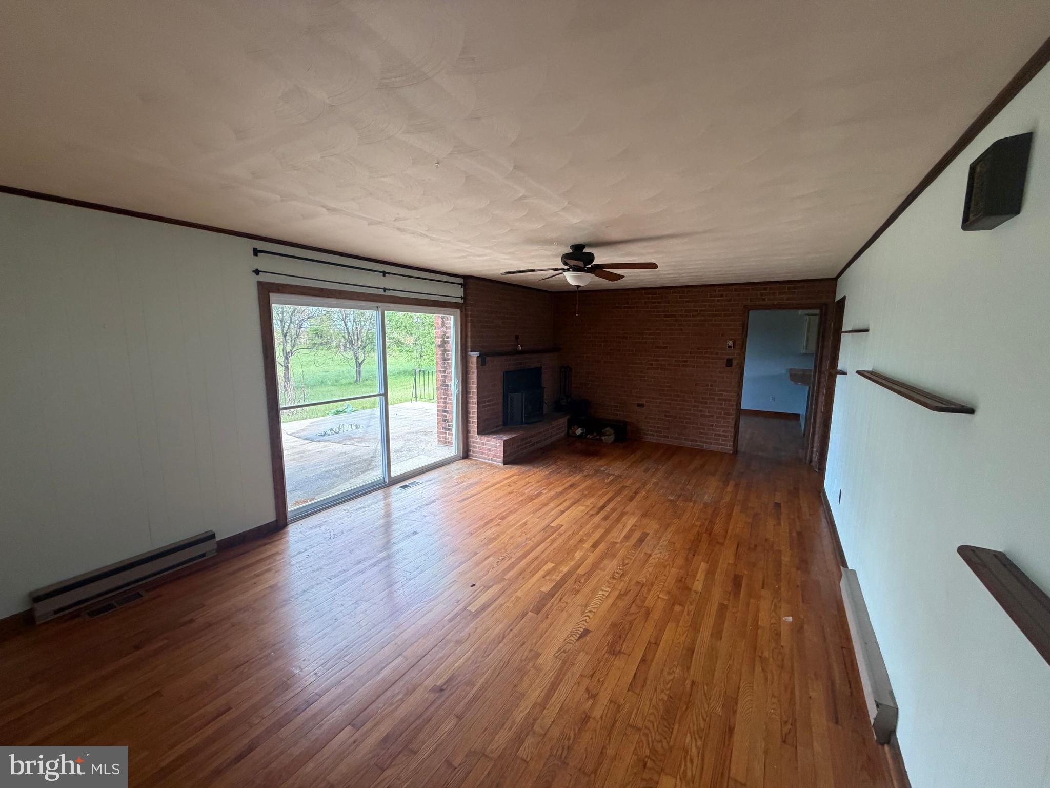 116 Rehoboth Lane Summit Point, WV 25446 - Photo 5 of 14 wooden floor in an empty room with a window