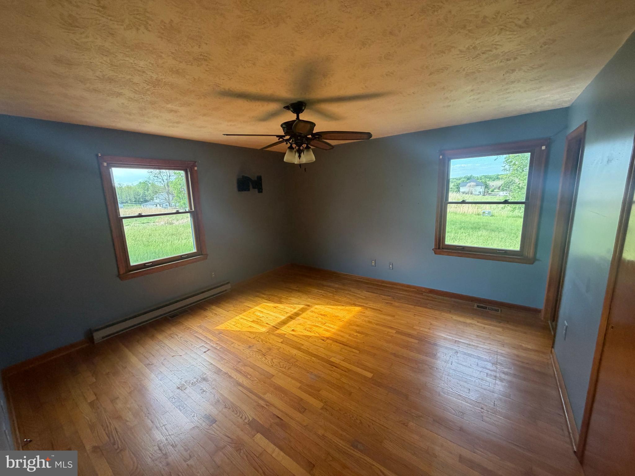 116 Rehoboth Lane Summit Point, WV 25446 - Photo 10 of 14 wooden floor in an empty room with a window