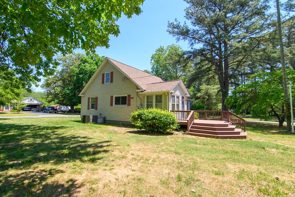 24432 Maxwell Street Parksley, VA 23421 - Photo 29 of 39 a front view of a house with a yard