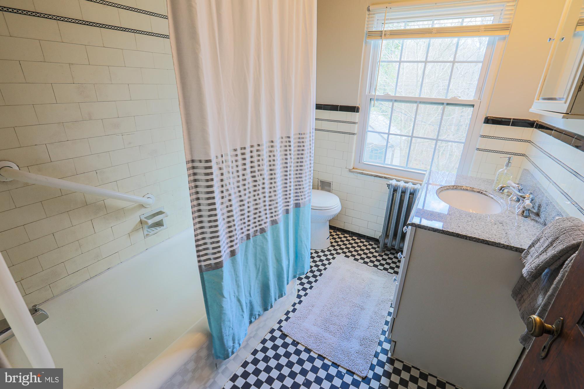 425 Nottingham Road Baltimore, MD 21229 - Photo 45 of 70 Full bath with original tub and tile