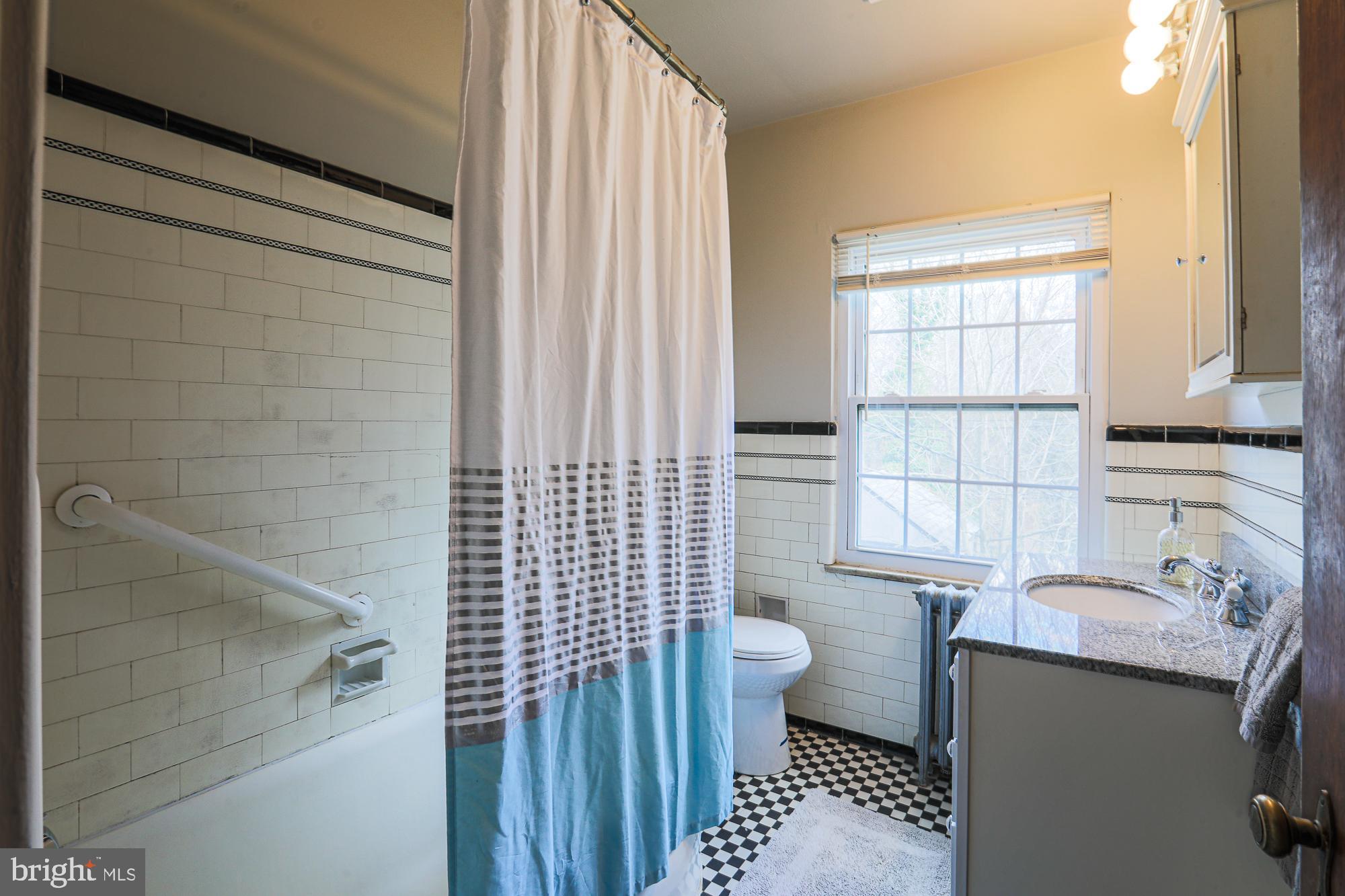 425 Nottingham Road Baltimore, MD 21229 - Photo 46 of 70 Full bath with original tub and tile