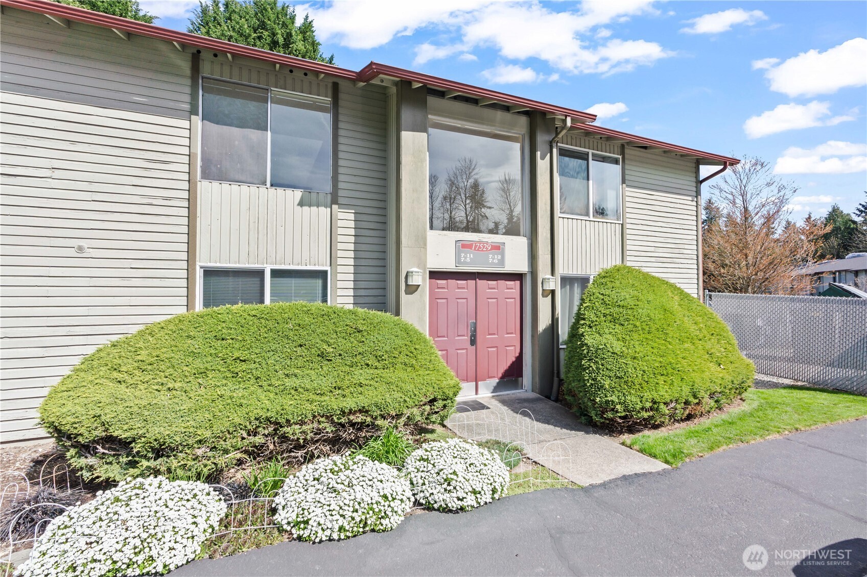17529 151st Avenue Southeast, Unit 711 Renton, WA 98058 - Photo 1 of 25 a view of a backyard with a garden and plants