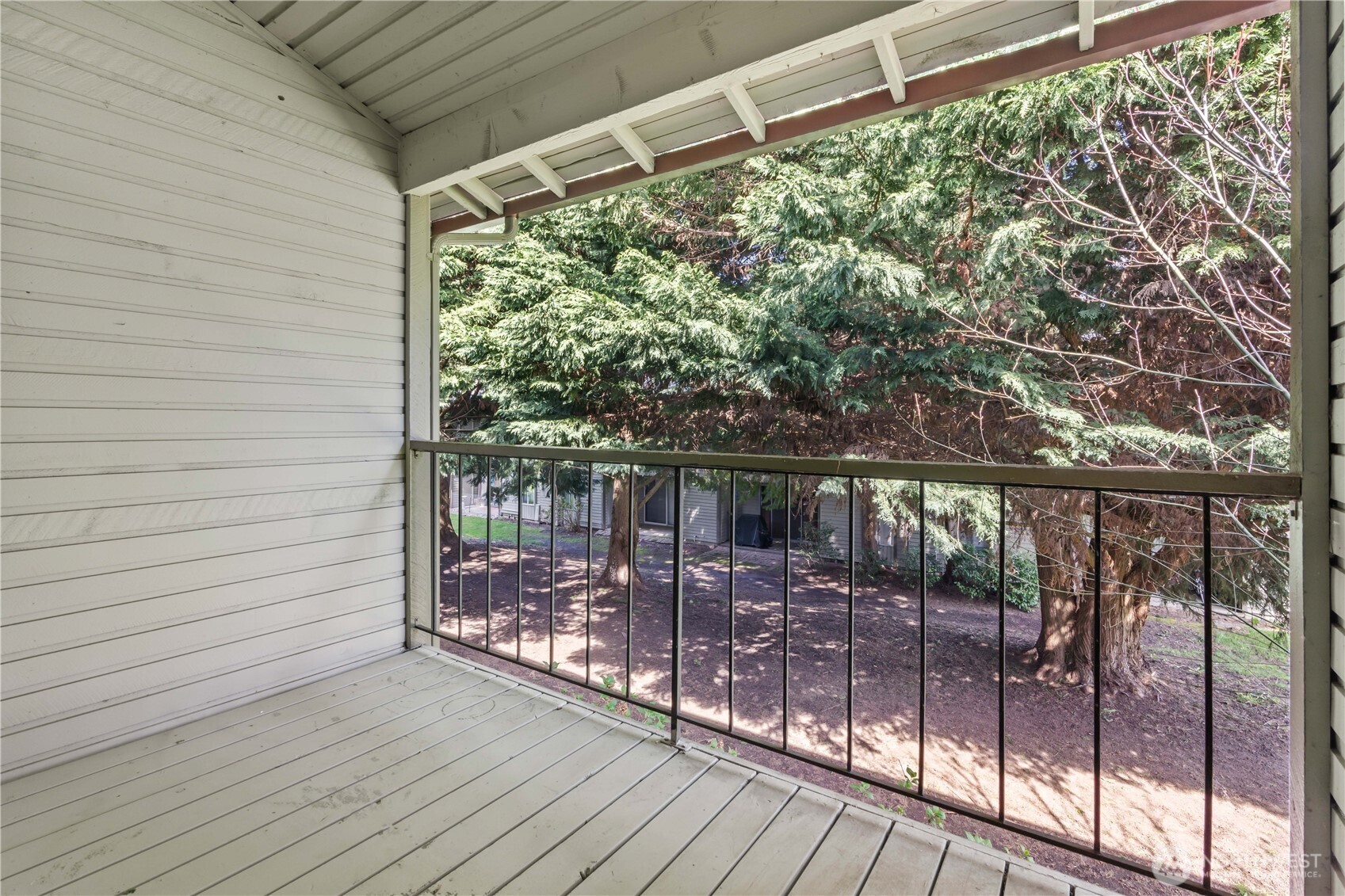 17529 151st Avenue Southeast, Unit 711 Renton, WA 98058 - Photo 15 of 25 a view of a balcony with wooden floor