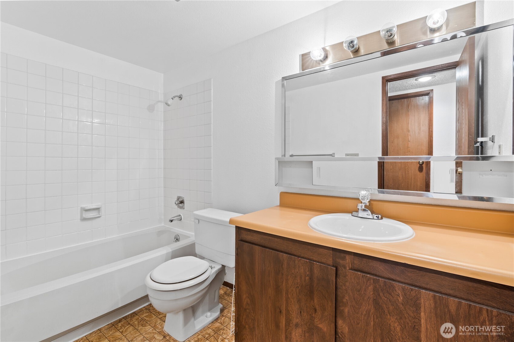 17529 151st Avenue Southeast, Unit 711 Renton, WA 98058 - Photo 18 of 25 a bathroom with a sink toilet and shower