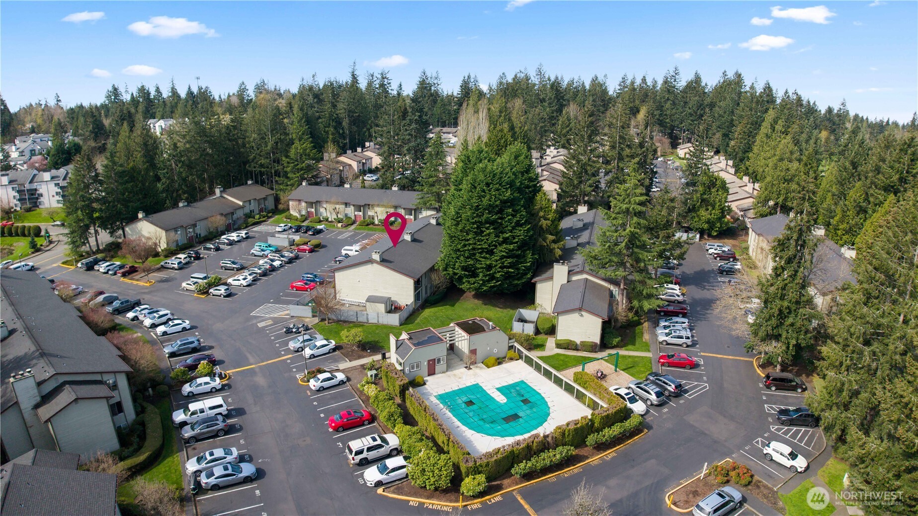 17529 151st Avenue Southeast, Unit 711 Renton, WA 98058 - Photo 24 of 25 an aerial view of a swimming pool patio and outdoor seating