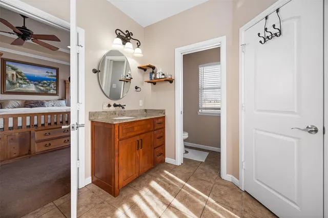 a view of bathroom with dual sinks
