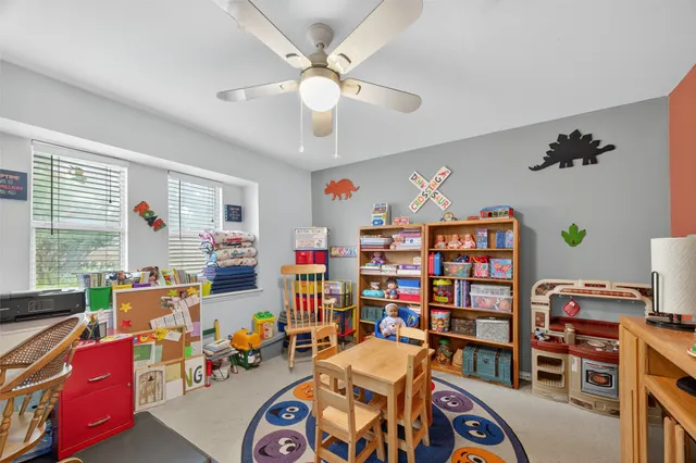 a view of a house with a yard deck and a garden