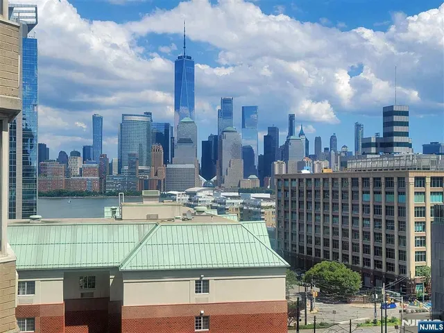 a view of a city with tall buildings