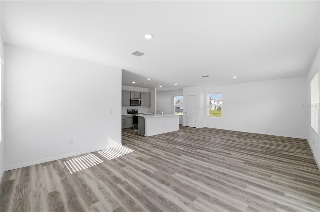 17786 Acorn Drop Road Land O Lakes, FL 34638 - Photo 13 of 50 a view of empty room with wooden floor