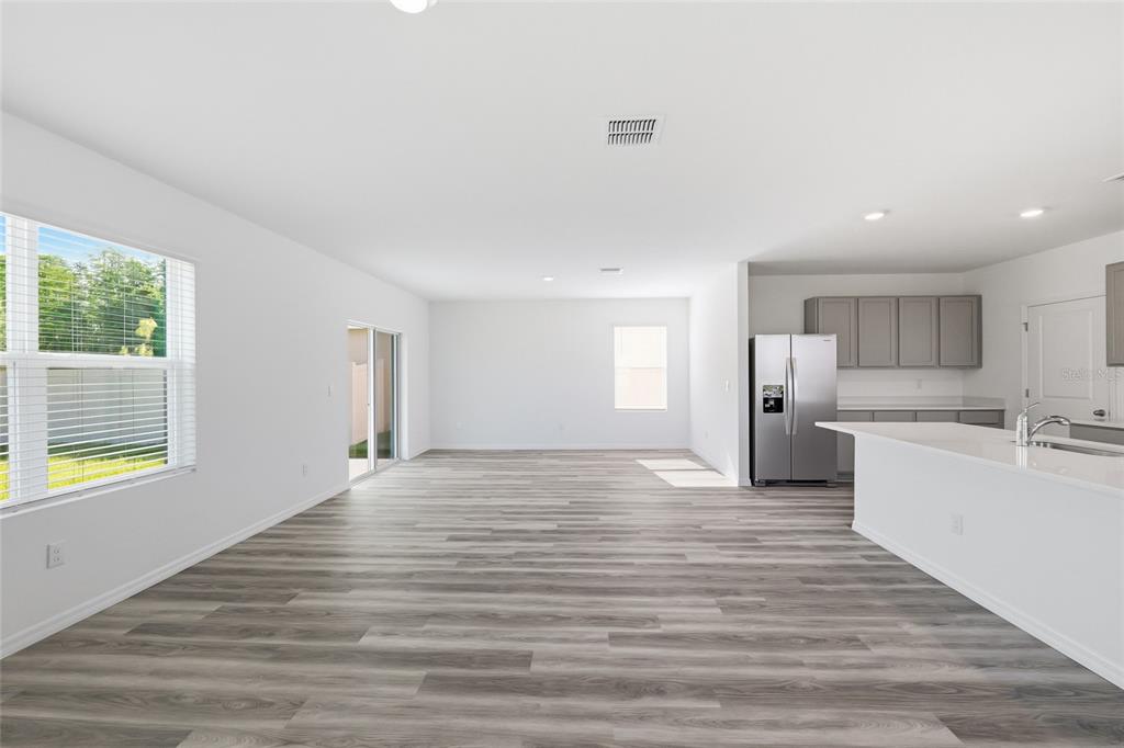 17786 Acorn Drop Road Land O Lakes, FL 34638 - Photo 14 of 50 a view of a kitchen with wooden floor and a window