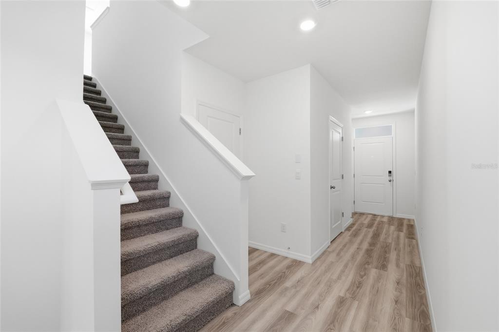17786 Acorn Drop Road Land O Lakes, FL 34638 - Photo 17 of 50 a view of a hallway with wooden floor