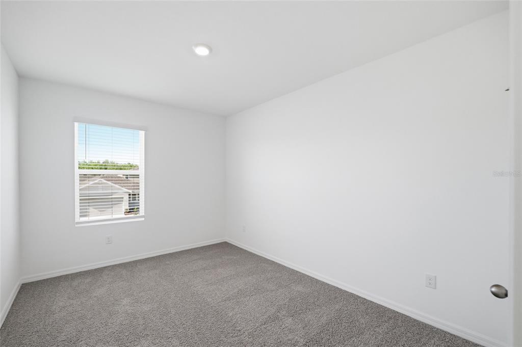 17786 Acorn Drop Road Land O Lakes, FL 34638 - Photo 20 of 50 an empty room with a window