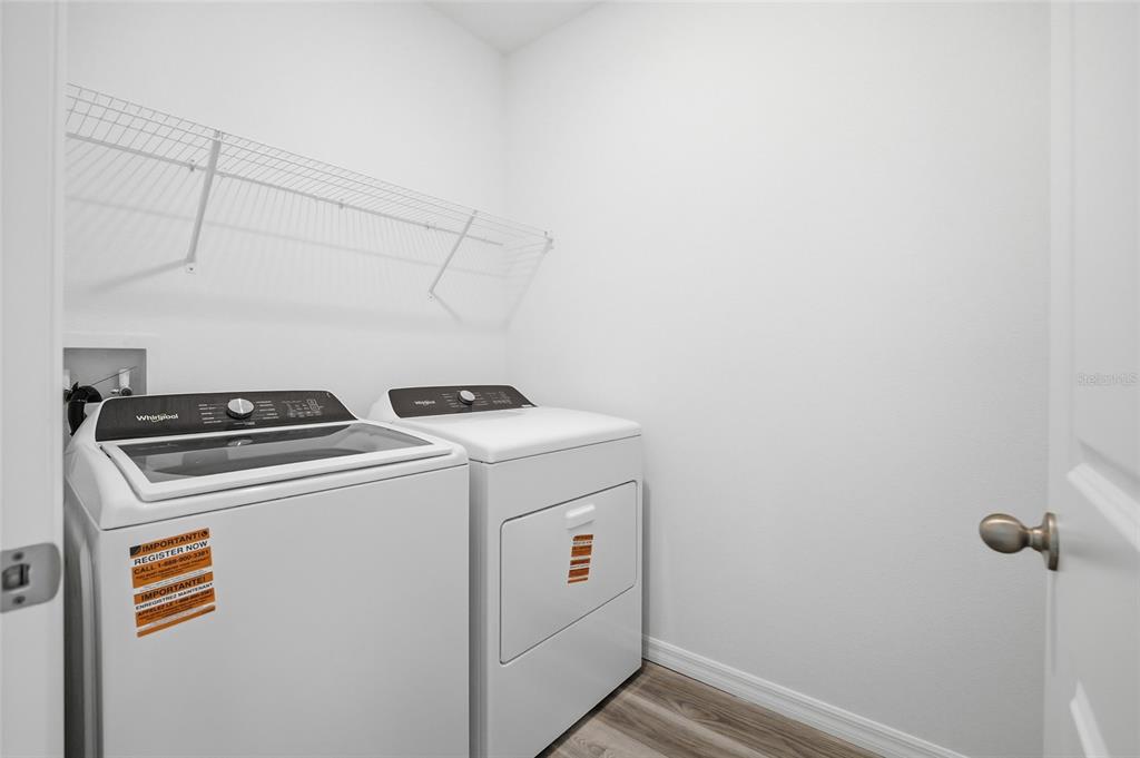 17786 Acorn Drop Road Land O Lakes, FL 34638 - Photo 29 of 50 a utility room with dryer and washer