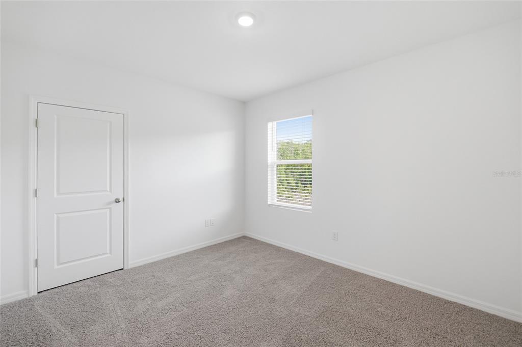 17786 Acorn Drop Road Land O Lakes, FL 34638 - Photo 37 of 50 an empty room with a window