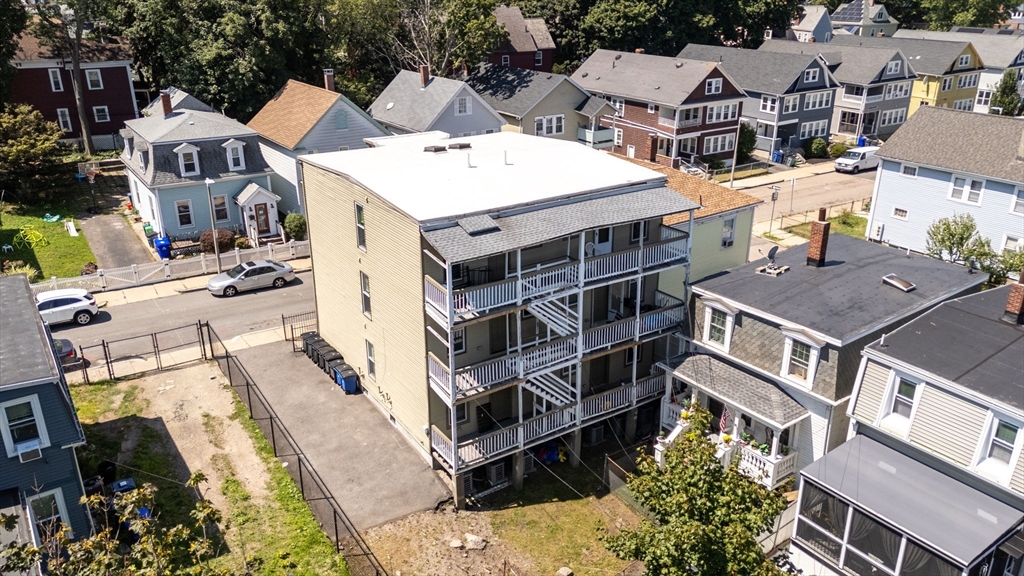39-41 West Walnut Park Boston, MA 02119 - Photo 8 of 20 an aerial view of a residential apartment building with a yard