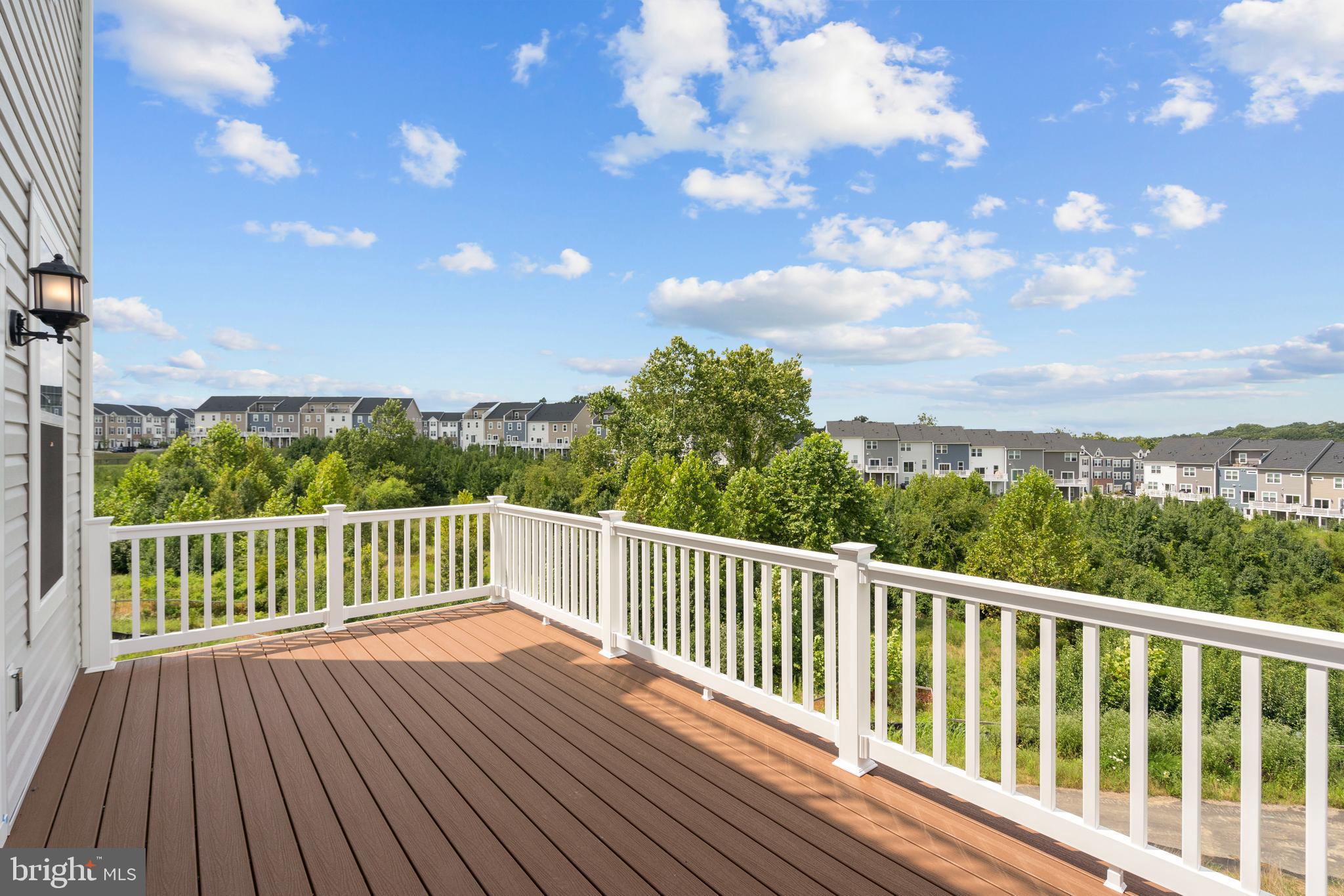 516 Downswing Road Pikesville, MD 21208 - Photo 4 of 5 a view of balcony with wooden floor