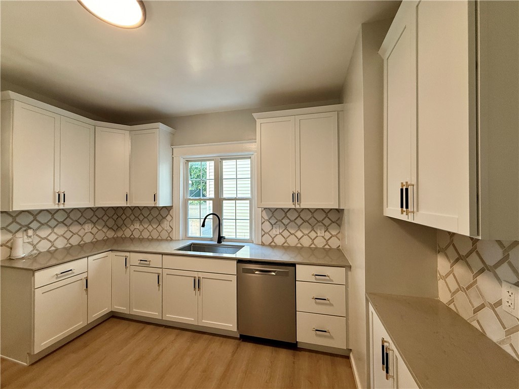 171 Cedarwood Terrace Rochester, NY 14609 - Photo 8 of 29 New cabinets with stylish closures.