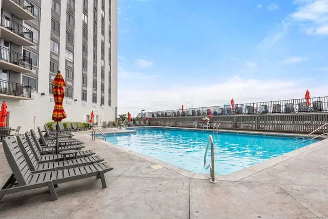 a view of a swimming pool with a lounge chair