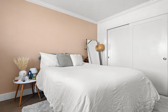 a bedroom with a bed and a table