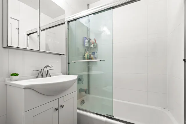 a bathroom with a sink a bathtub and a shower